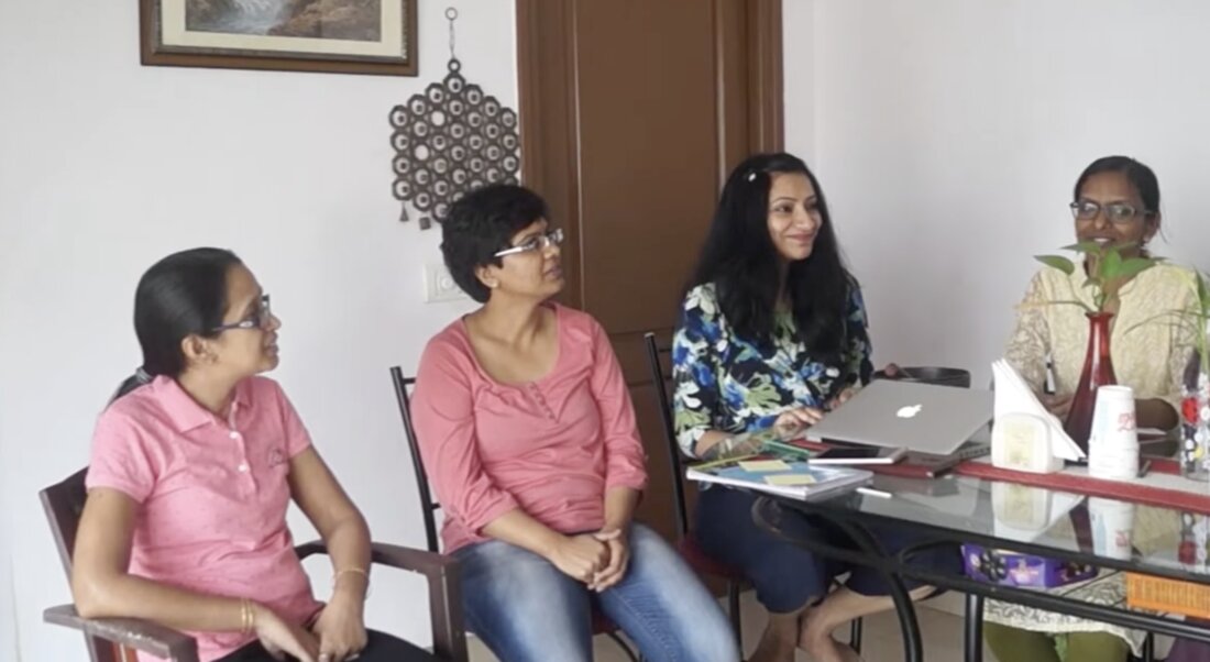 Women in an engaged discussion together, in conversation